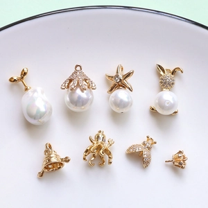Gold-plated brass pendants with pearls and zircons in octopus and sprout designs