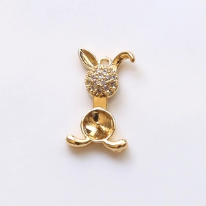 Detailed view of a gold-plated rabbit pendant base with micro-paved sparkling cubic zirconia