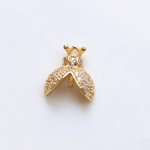 Detailed view of gold-plated ladybug pendant featuring micro-paved cubic zirconia stones