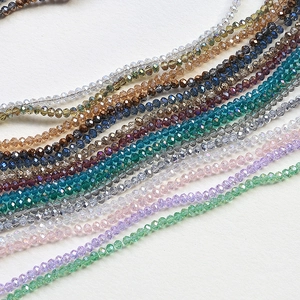 Macro view of multi-faceted crystal wheel beads for DIY jewelry making in various colors