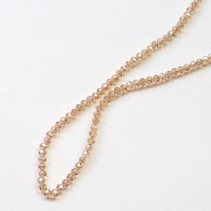 Macro shot of faceted champagne crystal beads for DIY jewelry and necklace crafting