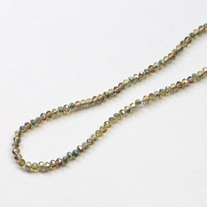 Macro detail of olive green faceted crystal beads with AB coating for DIY jewelry