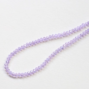 Macro shot of multifaceted lavender crystal beads for DIY handmade jewelry crafting