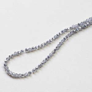 Macro shot of 3mm-4mm grey faceted crystal rondelle beads for DIY jewelry making