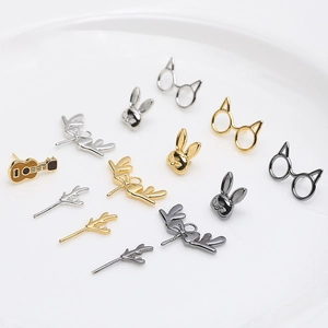 DIY jewelry charms including gold rabbit, deer antlers, and guitar for Baroque accessories