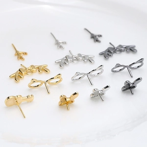 Detailed set of gold, silver and black DIY earring components in deer and rabbit shapes