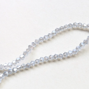 Detail of 4mm light blue faceted bicone crystal beads for DIY jewelry making and crafts