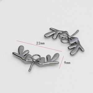 Detail of gunmetal antler bow jewelry connector with 22mm x 9mm size measurement