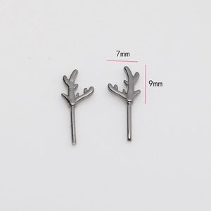 Macro view showing 7mm by 9mm dimensions of vintage antler studs in dark gunmetal finish