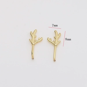Macro shot of 7mm by 9mm gold-plated elk antler charms for DIY earring making