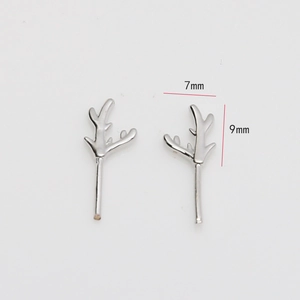 Detail view of small silver antler stud earrings with 7mm and 9mm size dimensions