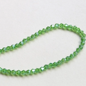 Macro detail of grass green faceted crystal beads for DIY handmade jewelry and necklaces
