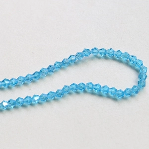 Macro view of 4mm light blue faceted bicone crystal beads for DIY jewelry making