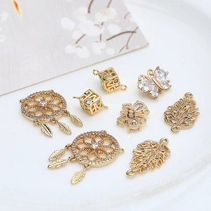 Gold plated dreamcatcher butterfly and leaf pendants with sparkling cubic zirconia