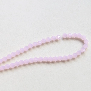 Macro shot of 4mm faceted lavender crystal bicone beads for DIY jewelry making