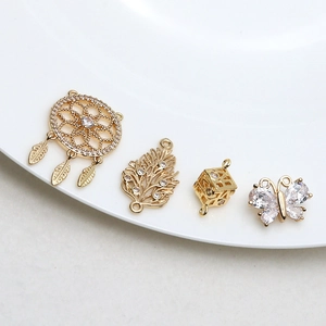 Gold-plated dreamcatcher butterfly and leaf pendants with sparkling cubic zirconia charms