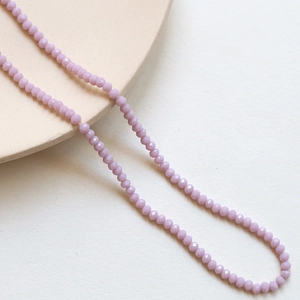 Detailed macro of 3mm lavender faceted crystal beads for DIY handmade jewelry crafts
