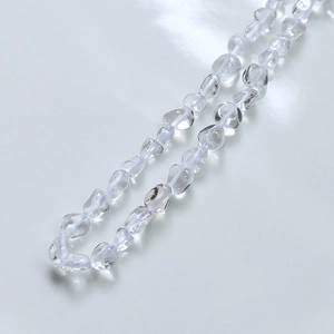 Macro detail of irregular clear crystal beads for DIY jewelry and necklaces