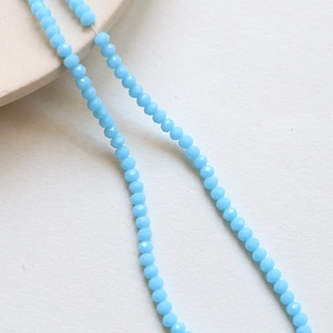 Macro shot of 3mm sky blue faceted crystal beads for DIY jewelry making