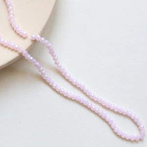 Macro shot of 3mm light purple faceted crystal rondelle beads for jewelry making
