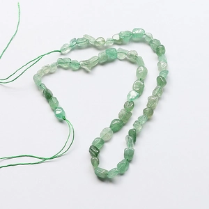 Detail of green aventurine irregular stone beads for DIY jewelry making and necklaces