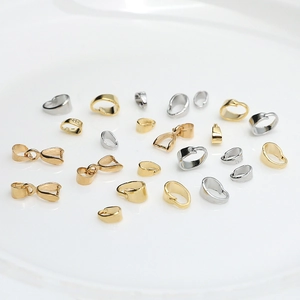 Macro detail of S925 stamped gold and silver pinch bails for DIY jewelry making