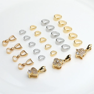 Detailed collection of gold and silver plated jewelry clasps with zircon heart and clover shapes