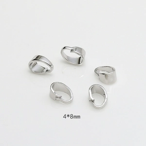 Macro detail of 4x8mm silver pinch bails for DIY jewelry making and pendant connectors