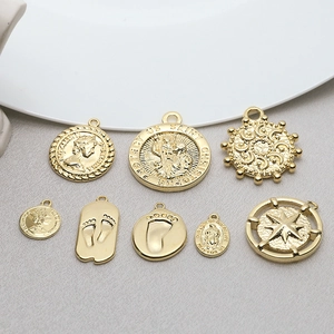 Vintage gold coin pendants with Queen Elizabeth portrait and saint motifs for DIY jewelry