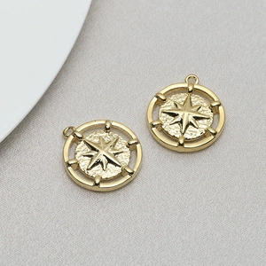 Detail of vintage gold compass star pendant with hammered texture for DIY jewelry