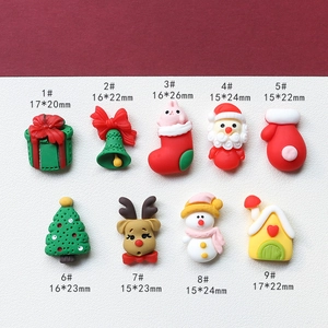 Detailed view of 9 Christmas resin charms including Snowman and Santa for DIY crafts
