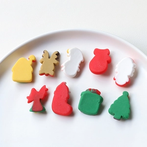 Macro view of Christmas resin charms including snowman and reindeer for DIY crafts