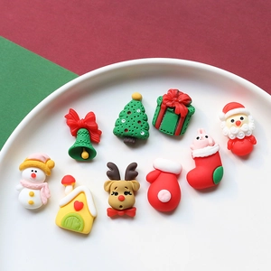 Flat lay of Christmas resin charms including snowman, elk and Santa for DIY crafts