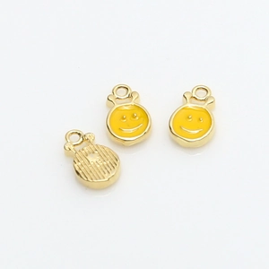 Three mini gold-plated smiley face charms with yellow enamel for DIY jewelry making