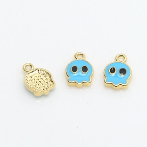 Detailed view of pixel ghost charms with gold plating and blue enamel finish