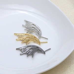 Detail of micro-pave wing jewelry findings in gold, silver and gunmetal finishes