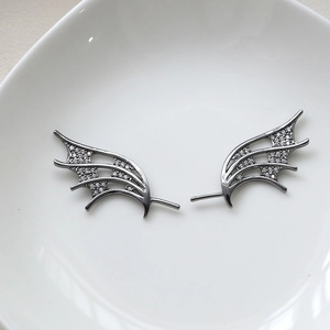 Macro shot of gothic bat wings with micro-pave cubic zirconia on a white plate