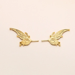 Detailed view of gold-plated fairy wings with intricate texture for jewelry making