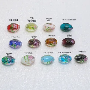 Detailed assortment of handmade oval lampwork glass beads with gold foil and flower patterns