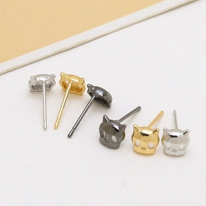 Minimalist cat shaped stud earrings in gold silver and gun grey metal finishes