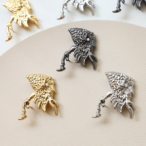 Unique gold silver and black mythical dragon earrings with white cubic zirconia accents