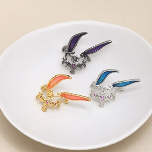 Macro view of fantasy rabbit head crowns with colorful enamel and vintage scrollwork