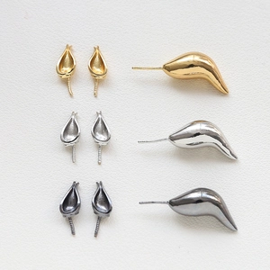 Detail of baroque gold-plated earring parts in gold, silver, and gun black finishes