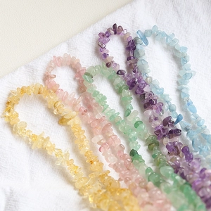 Macro shot of colorful irregular natural tourmaline stone beads for DIY jewelry making