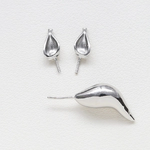 Close-up of polished silver earring components for DIY baroque pearl jewelry making