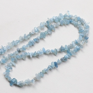 Close-up of irregular light blue tourmaline stone beads for DIY jewelry making