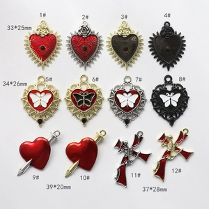 Detailed view of Gothic alloy pendants featuring heart, rose, and skull motifs in 3x4 grid