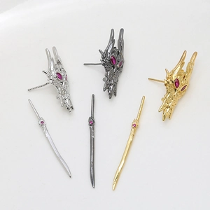 Fantasy dragon mask and sword earrings set in gold, silver, and gun black finishes