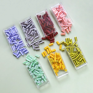 Colorful striped tube beads for DIY jewelry making in a transparent storage case