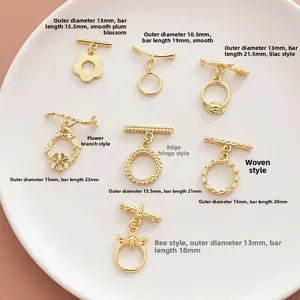 Detail of assorted 14k gold-plated OT toggles in various floral and geometric designs